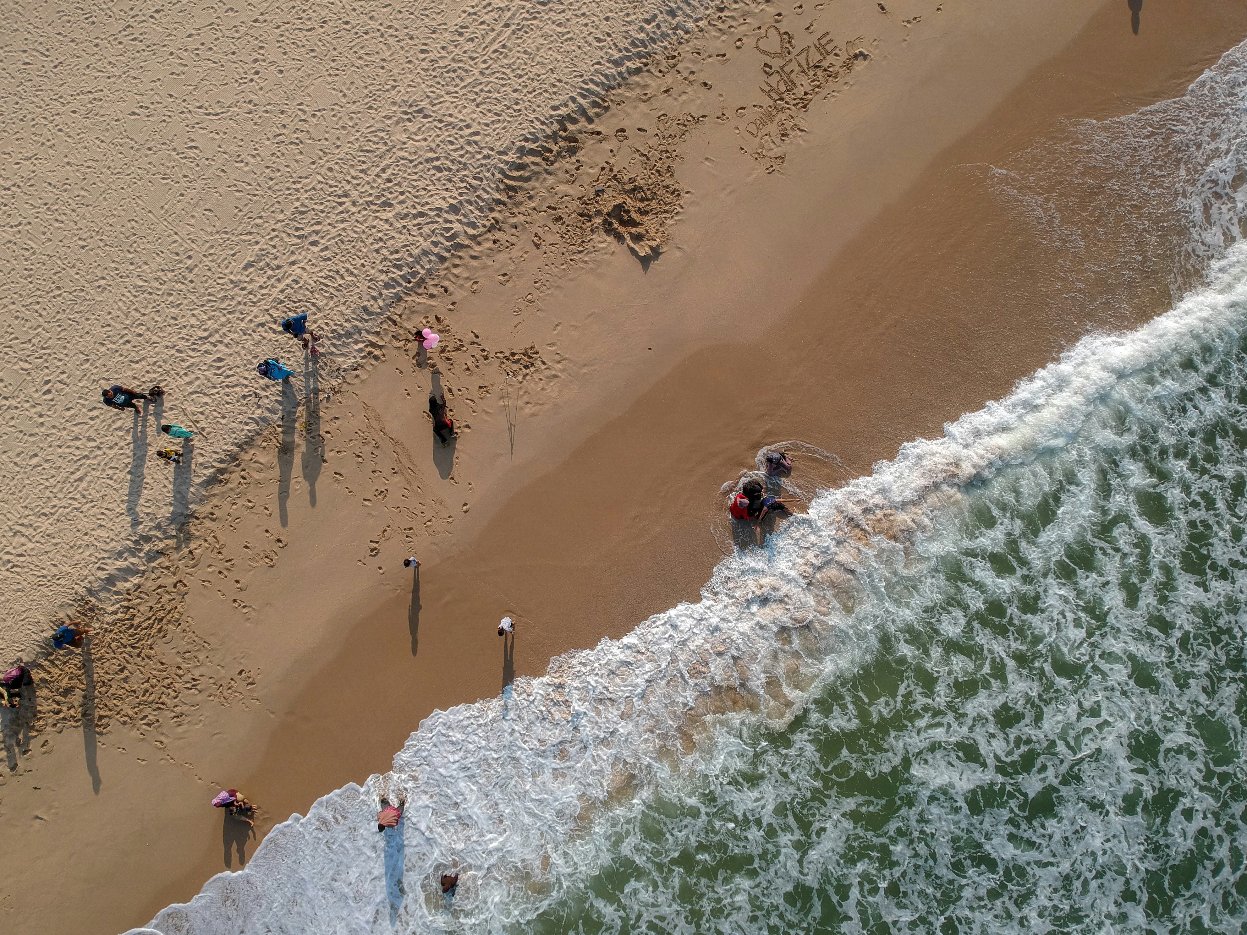 aerial view of sand and waves